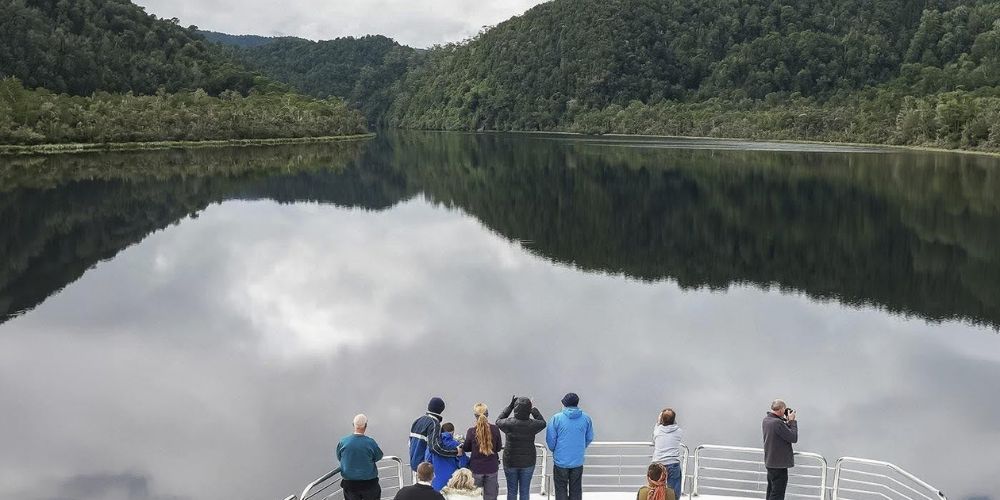 Guests taking in the scenery on a Gordon River cruise in Strahan, Tasmania